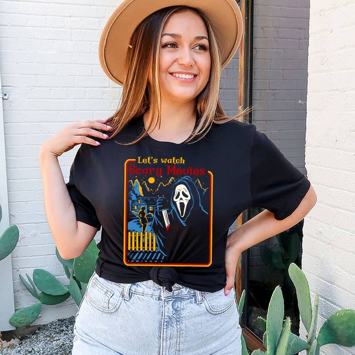 Black Let's Watch Horror Movies Scream - Retro Halloween T-Shirt for wholesale on Faire