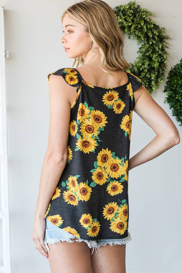 NERO TOP FLOREALE CON VOLANT in vendita all'ingrosso su Faire10