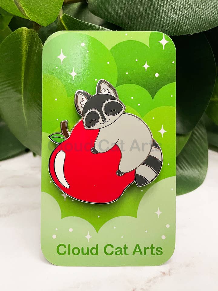Apple Raccoon - Hard Enamel Pin for wholesale by Cloud Cat Arts