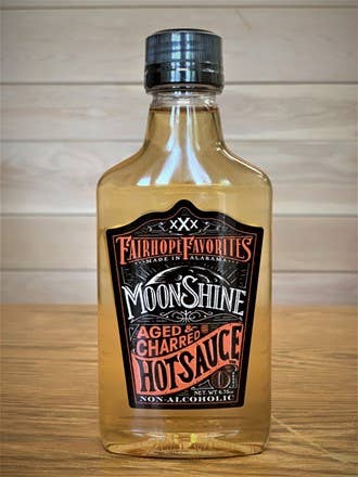 Aged N Charred (Bourbon) Moonshine Hotsauce Small Flask for wholesale by Fairhope Favorites, Inc.