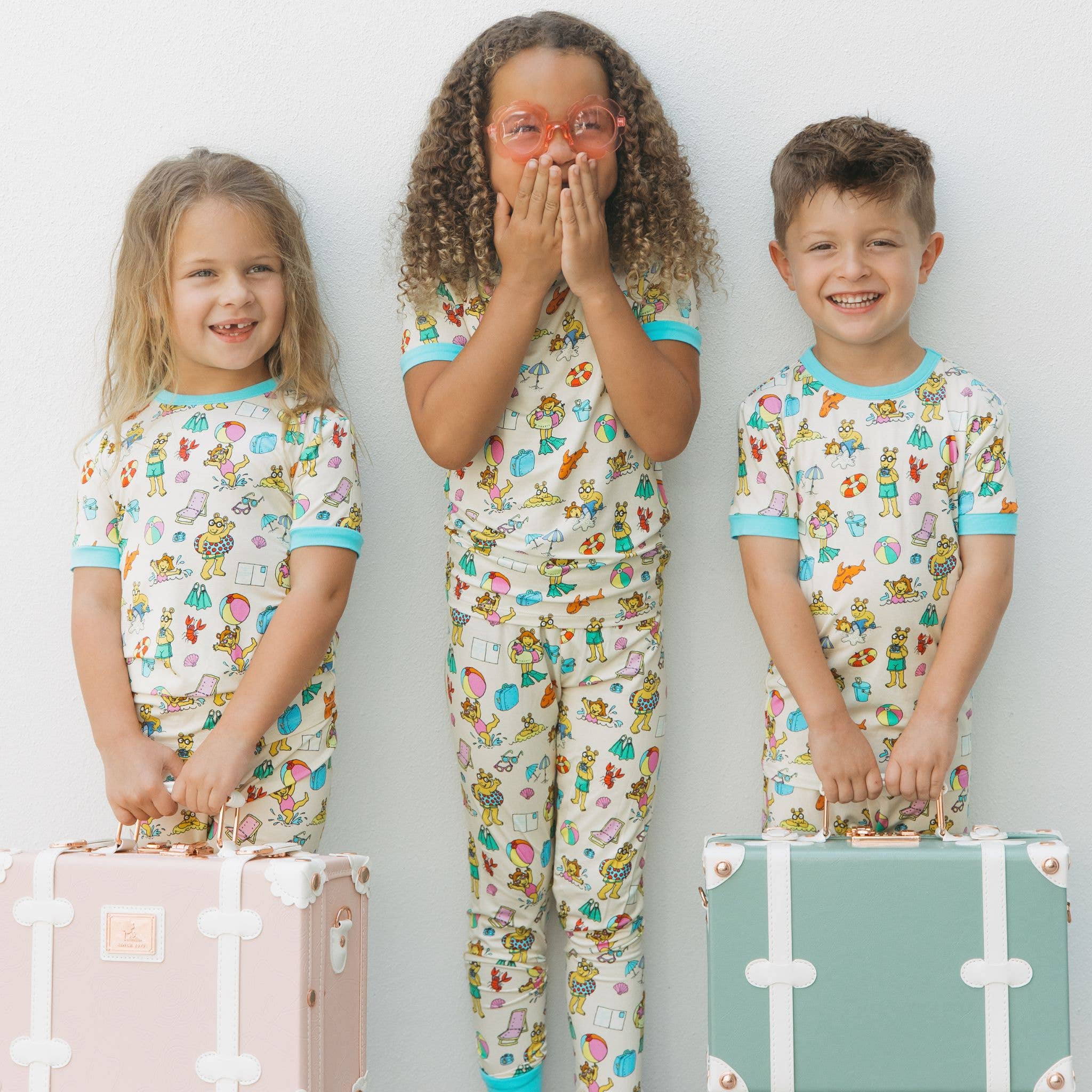 Cream Multi Arthur™ Family Vacation Bamboo Short Sleeve Kids Pajama Set for wholesale on Faire1