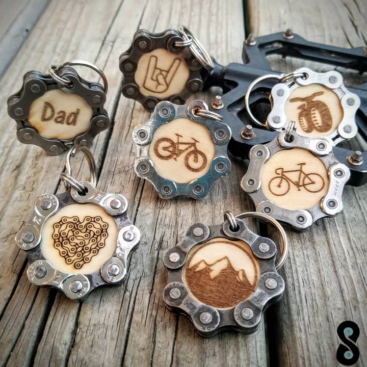 Assorted Bicycle Themed Keychains w/ Upcycled Bike Chain and other Purchase Wholesale bicycle. Free Returns & Net 60 Terms on Faire trending on Faire.