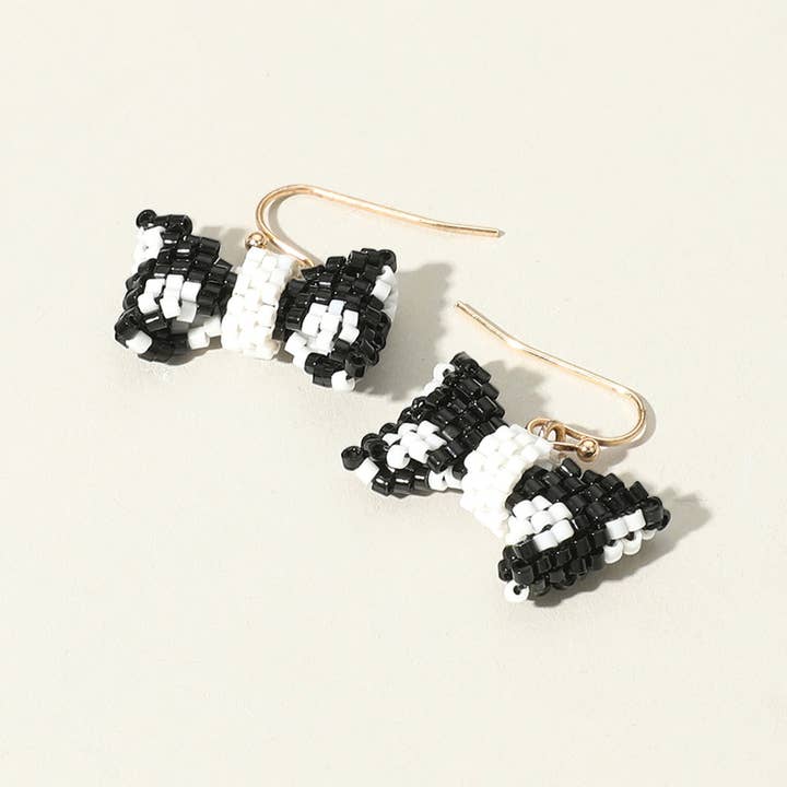 Orecchini a fiocco con perline di semi per la vendita all'ingrosso da parte di Sensibling Corp.