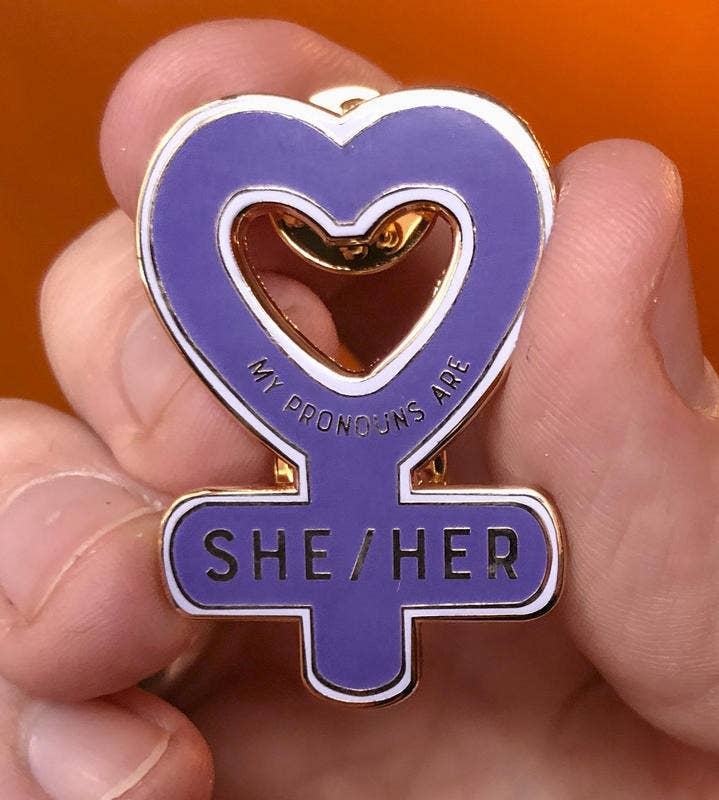 Microcosm Publishing & Distribution – wholesale Lapel pin/button – My Pronouns are She/Her Enamel Pin1