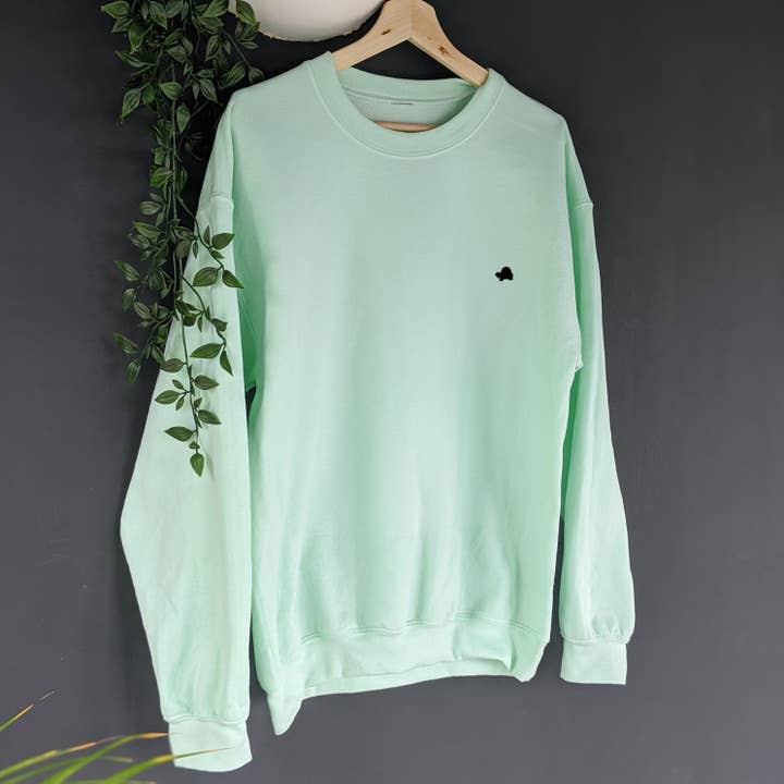 SUÉTER UNISSEX ATEMPORAL DE GOLA REDONDA por atacado de Tiny Tortle