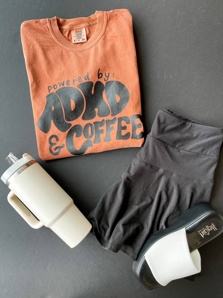 Powered By ADHD & Coffee | Women's Rusted Comfort Colors Gra for wholesale by Bizzy's Wholesale