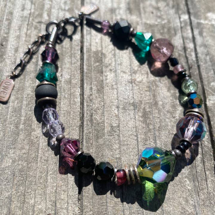 5 O'CLOCK NEWS BRACELET - AMETHYST+EMERALD CRYSTAL, BRONZE for wholesale by Owen Glass Collection