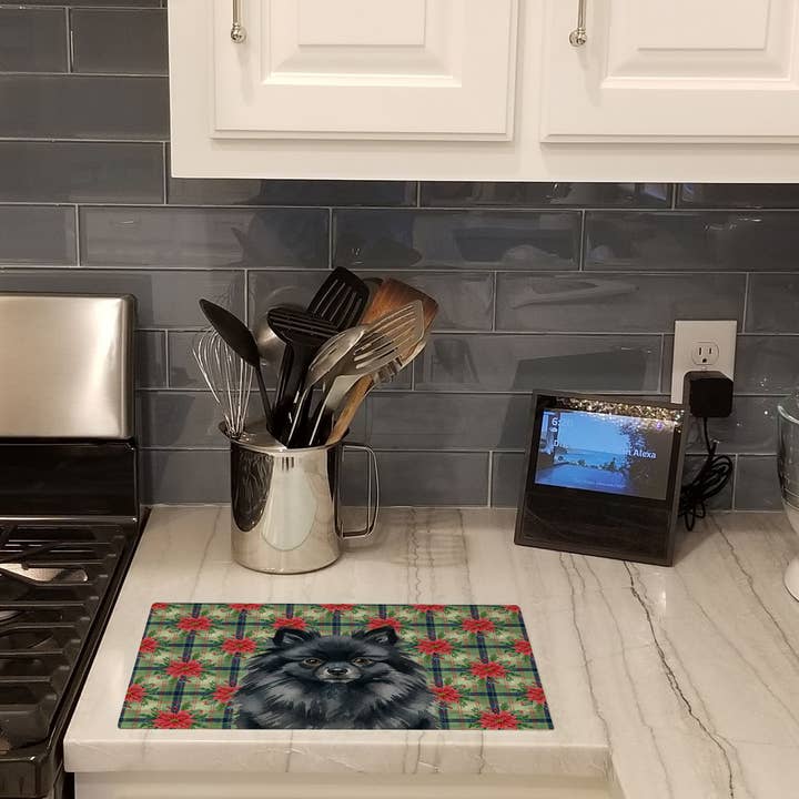 Black Pomeranian Christmas PoinsettIas Cutting Board WDK875 for wholesale by Caroline's Treasures