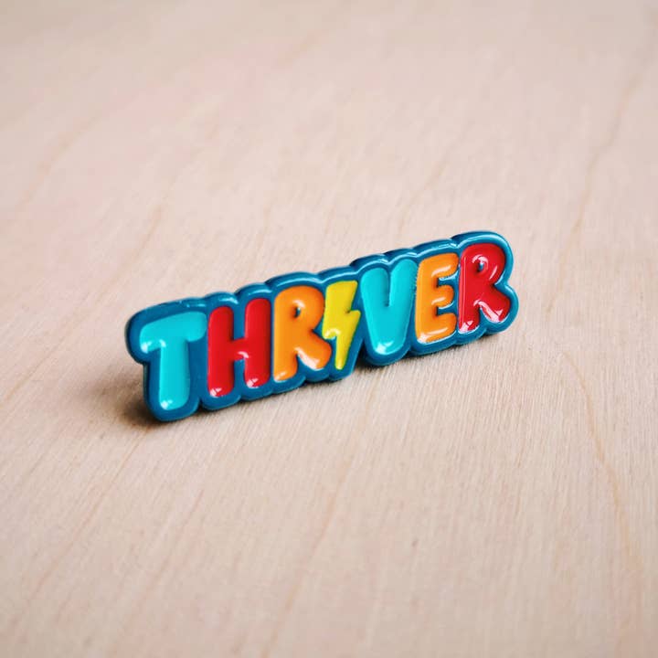 THRIVER enamel pin for wholesale by Fighty Pants.