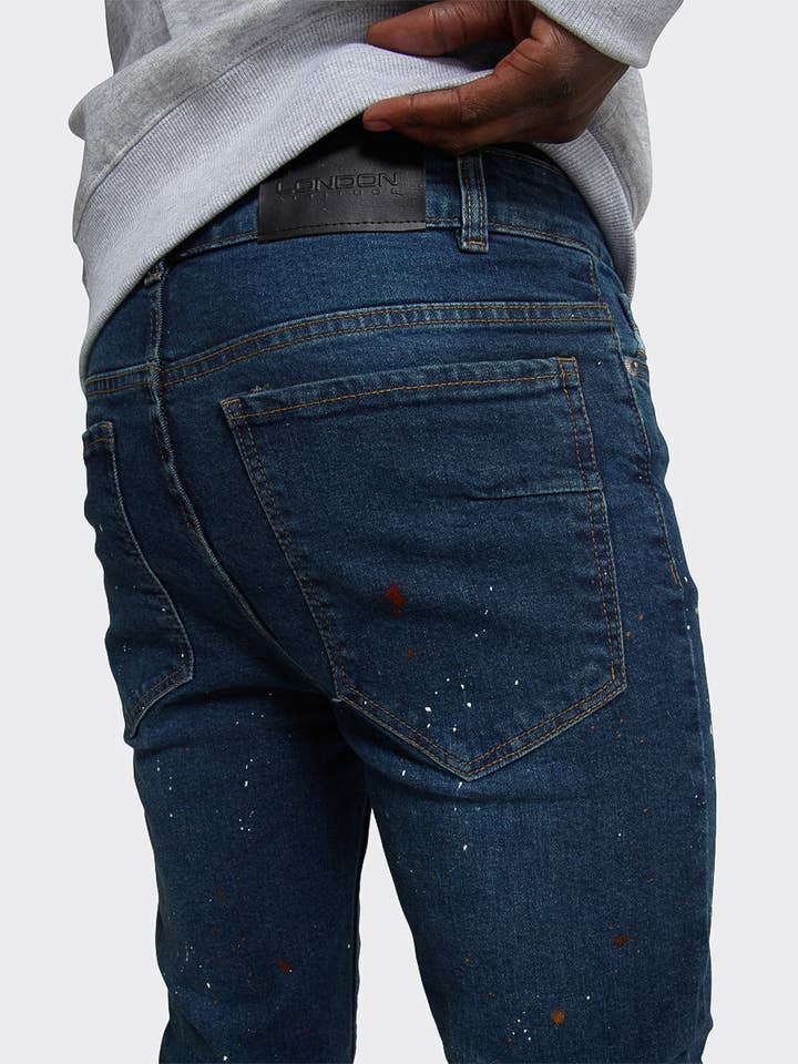 Skinny Jeans met verfspetter in donkerblauw voor wholesale door London Attitude