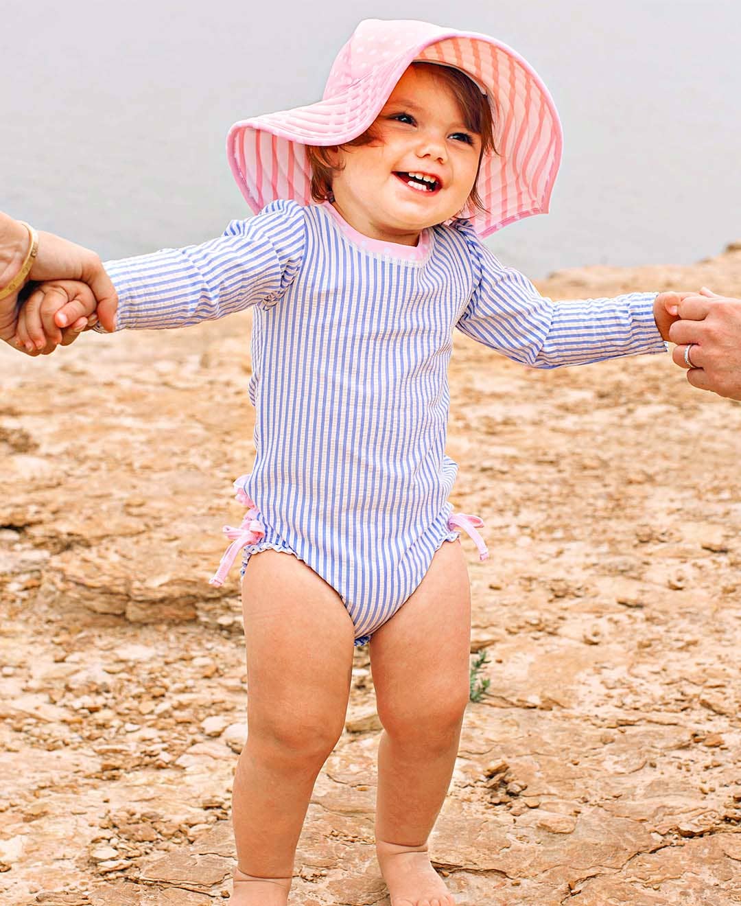 RuffleButts + RuggedButts - Wholesale Rashguard - Baby - Baby Girls Periwinkle Blue Seersucker Long Sleeve One Piece Rash Guard Swimsuit with Signature Rear Ruffles8