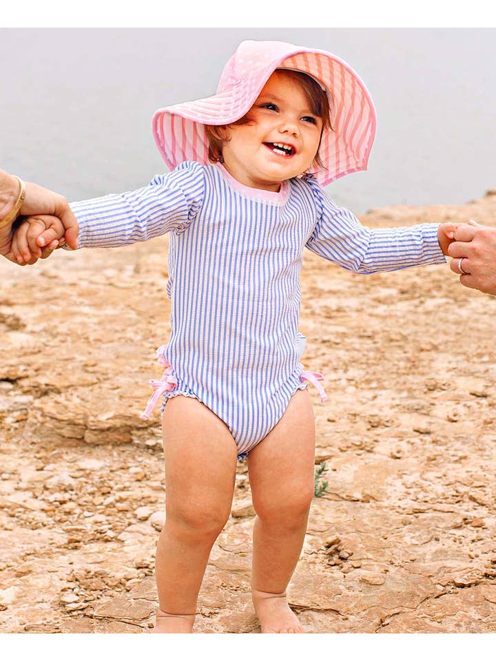 RuffleButts + RuggedButts - Wholesale Rashguard - Baby - Baby Girls Periwinkle Blue Seersucker Long Sleeve One Piece Rash Guard Swimsuit with Signature Rear Ruffles
8