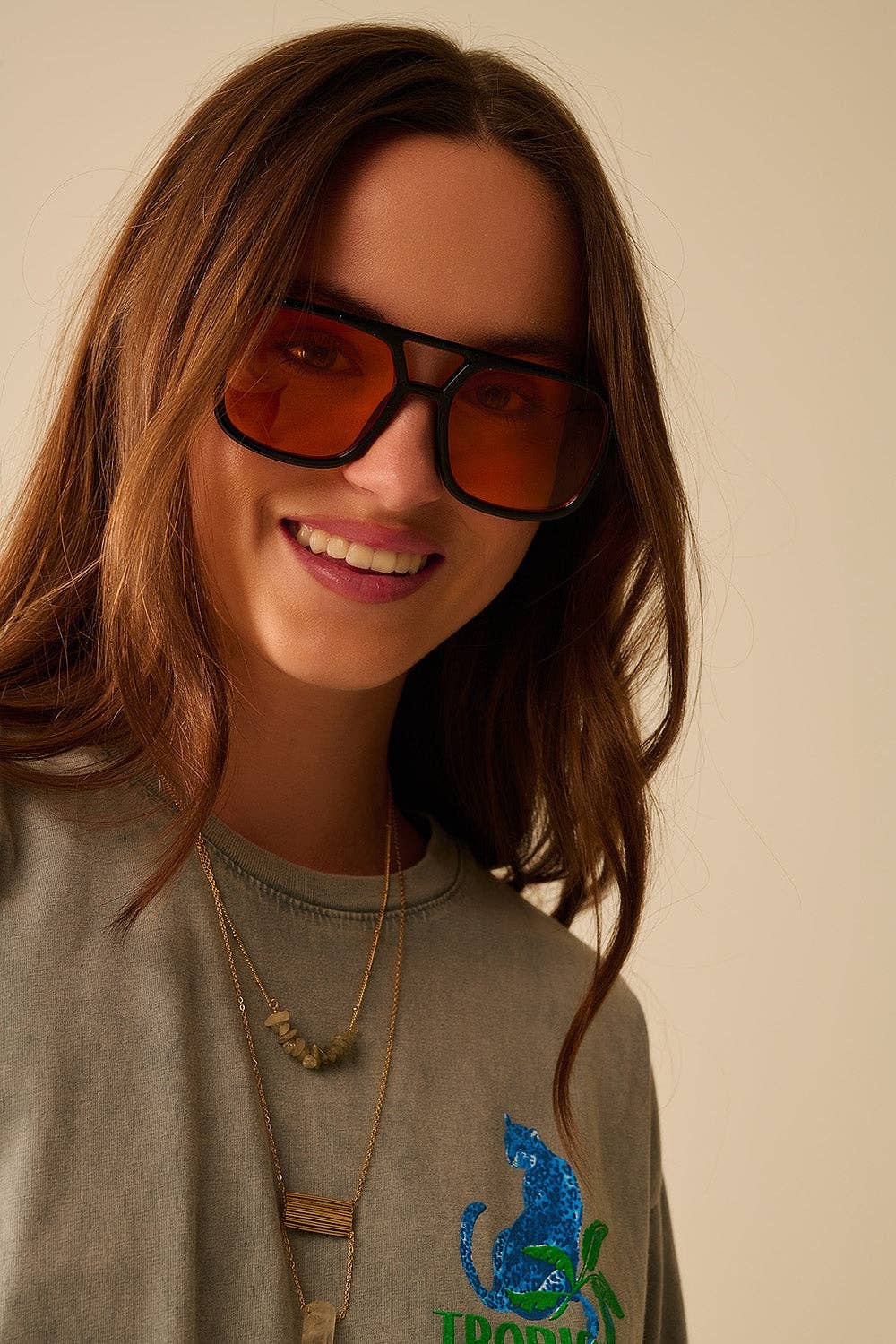 Sunglasses with black frames and orange lenses for wholesale on Faire0