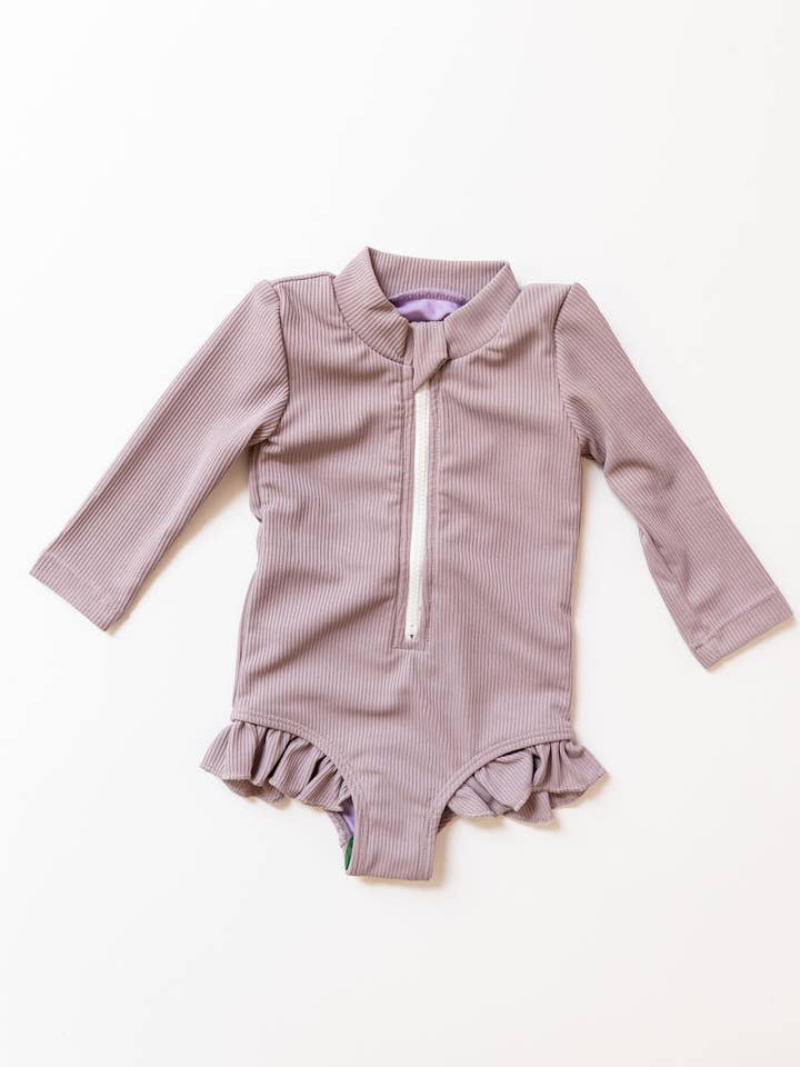 Sahara Ribbed One Piece Zip Up In Lavender for wholesale by Enci