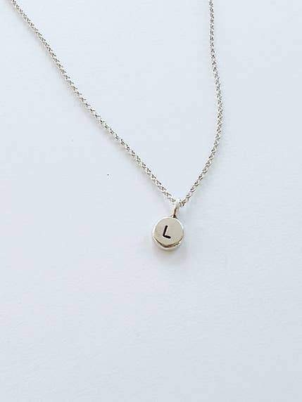 Hand Stamped Initial Pendant for wholesale by Free & Fleeting