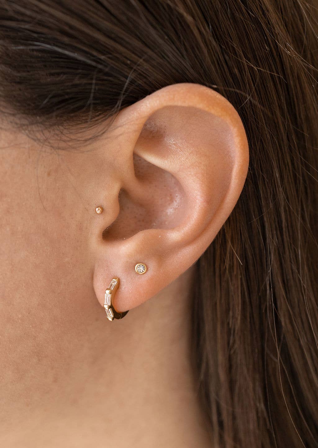 The Land of Salt - Wholesale Huggie Earrings - Clear CZ Baguette Huggie Hoops in Gold - Earrings1