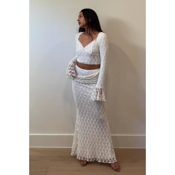 Top de manga larga con volantes de encaje con falda maxi para venta al por mayor de Salty