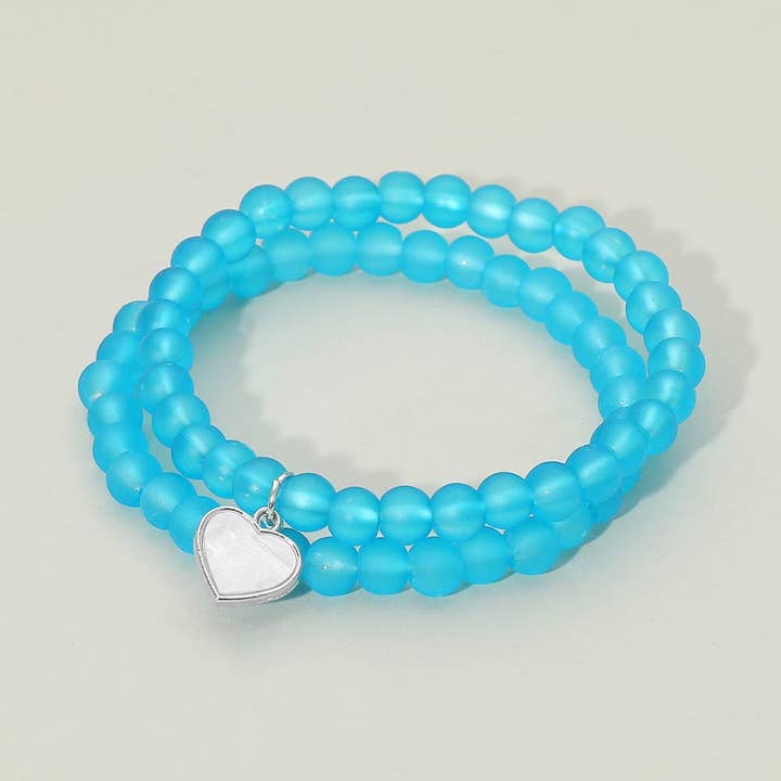 12 ENSEMBLES DE 2 - Bracelets élastiques à double couche avec breloque cœur en nacre pour la vente par Sensibling Corp.