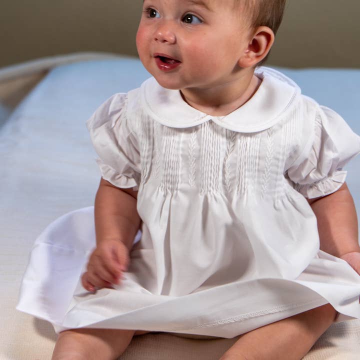 White Hand Embroidered & Pleated Dress with Bonnet for wholesale by Hello Bebes!