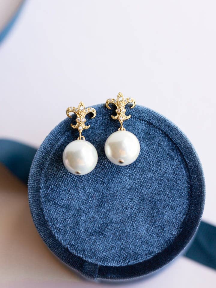 Gold Fleur-de-lis Pearl Earrings for wholesale by Rachelyn Jewelry