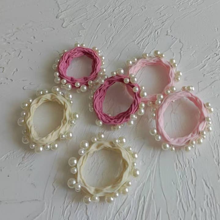 Assorted Pink Textured Seamless Pearl Hair Ties (Set of 6) for wholesale on Faire3