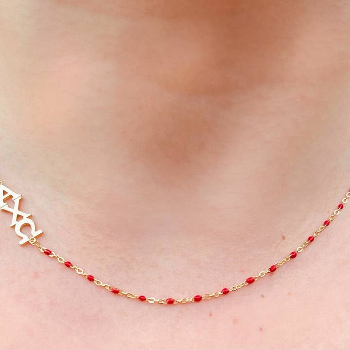 Red The Alpha Chi Omega Necklace: Side Set ΑΧΩ Enamel Bead Necklace for wholesale on Faire
