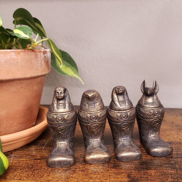 Discoveries, Inc. - Venta al por mayor Tarros decorativos - Jarras Canópicas Egipcias con Pies de Bronce - Juego de 4 - 4"2