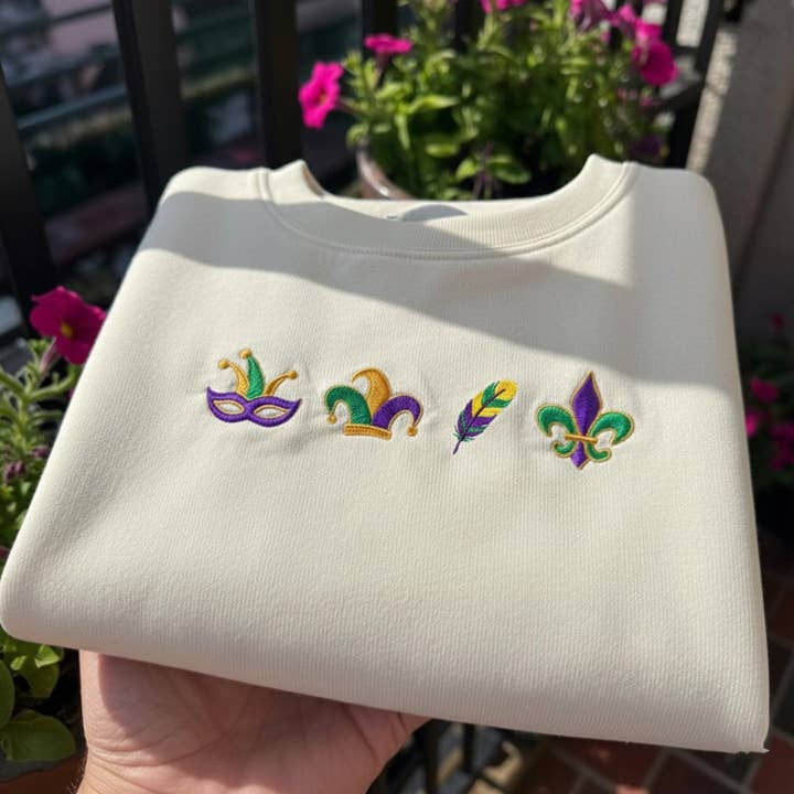 Mardi Gras Festive Icons Embroidered Sweater, Carnival Tee for wholesale by ClevorFit