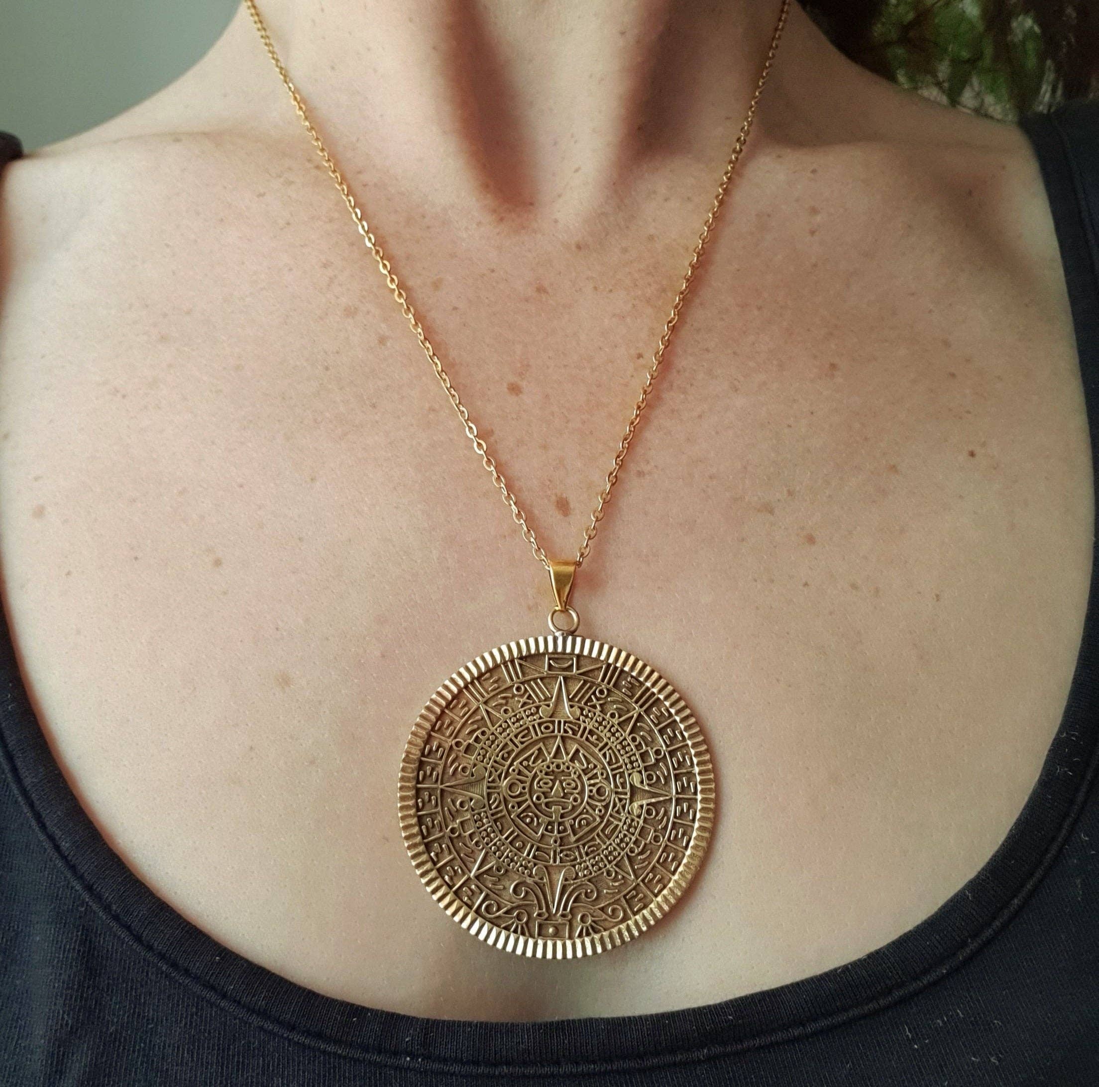 Kaali Boutique – wholesale Pendant/charm necklace – Gold Sacred Mayan Calendar Necklace / Hypoallergenic / Brass / Boho / Aztec / Inca / Ethnic / Hypoallergenic / Third Eye / Illuminati4