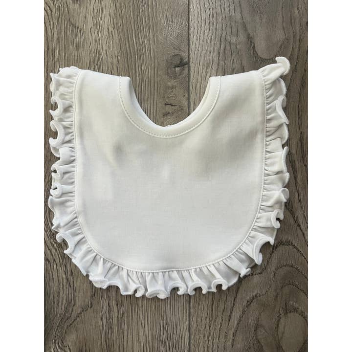 White Ruffle Bib for wholesale by Cute as Buttons