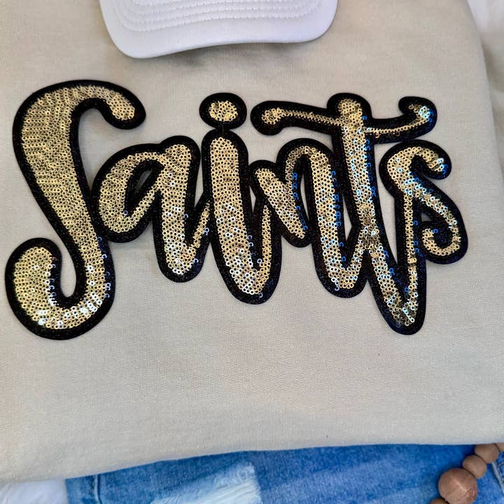 Sequin Script Saints Patch: Black Glitter Iron On Applique, School Mascot and other Purchase Wholesale sequin pins. Free Returns & Net 60 Terms on Faire trending on Faire.