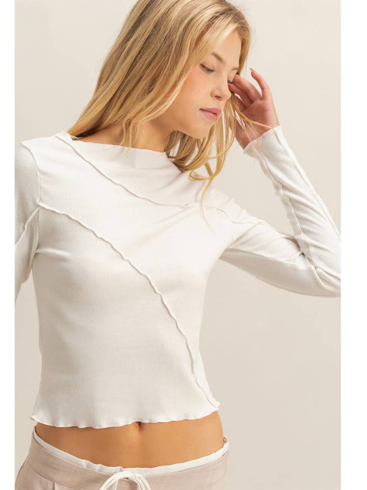 Asymmetrical Raw Edge Knit Long Sleeve Top and other Purchase Wholesale asymmetrical. Free Returns & Net 60 Terms on Faire trending on Faire.