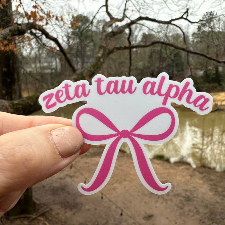 Sticker | ZTA | Zeta Tau Alpha Pink Bow | Waterproof Vinyl Sticker | White | Clear | Permanent | Removable | Window Cling | Glitter | Holographic for wholesale by My Vinyl Cut