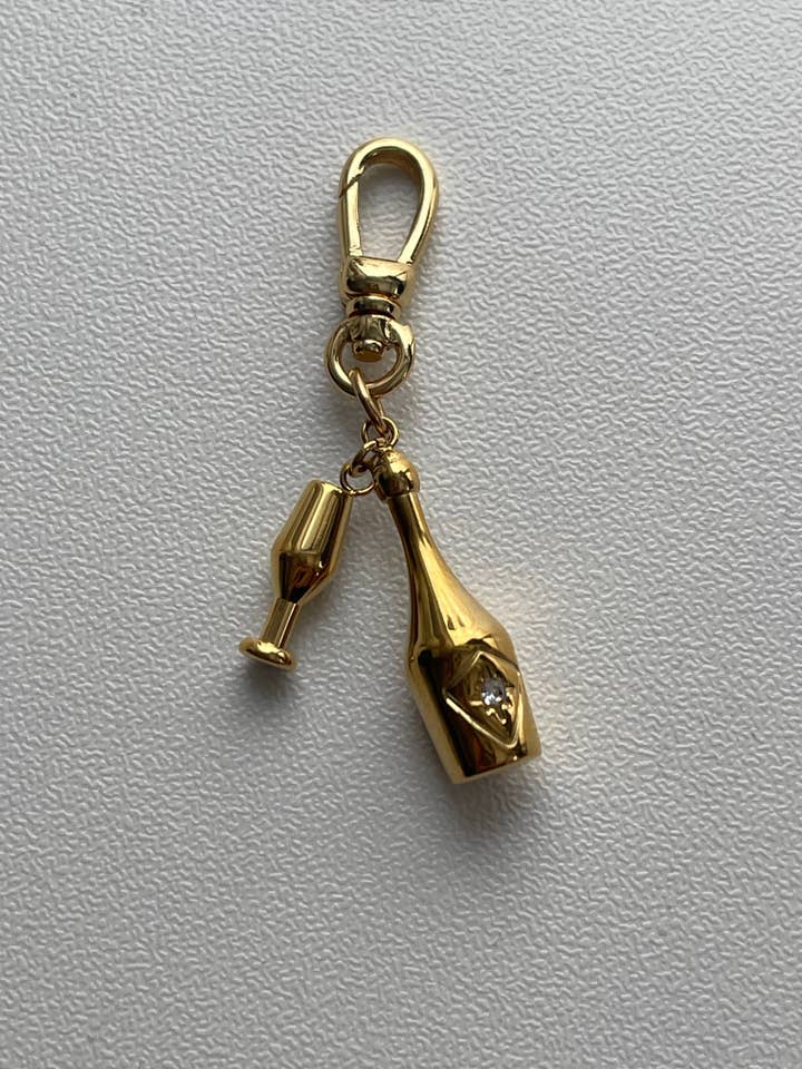 Cheers Champagne Charm for wholesale by AMD COLLECTIVE