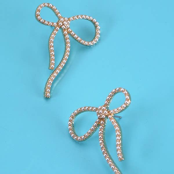 Gold BIG BOW PEARL STUD EARRINGS | 31E24163 for wholesale on Faire