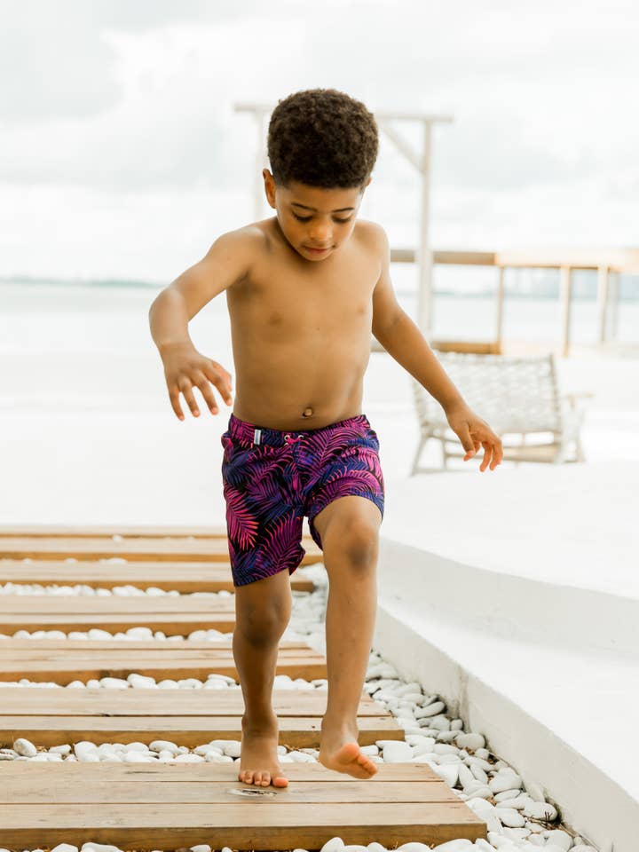 Black Boys Marine Glow Swim Trunks for wholesale on Faire