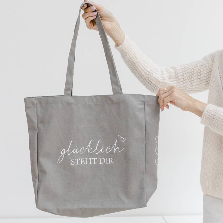 Cotton bag "Happiness suits you" for wholesale by Bake Affair GmbH