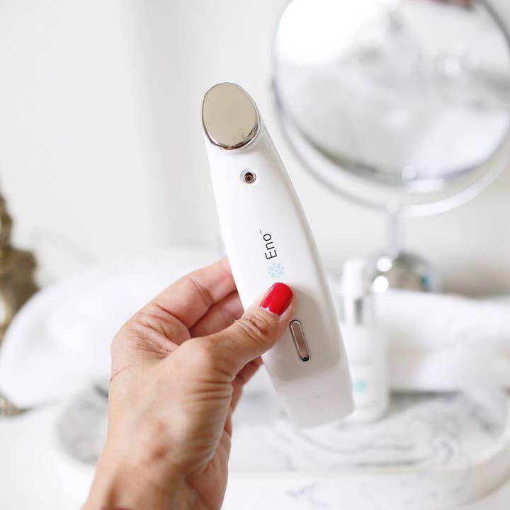 Nature Checkout Inc - Wholesale Electronic Skincare Device - Eno Patented All-In-One Skincare Device. The one device that does it all - exfoliation; product infusion & facial sculpting1