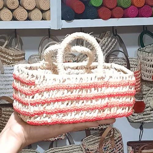 Moroccan straw basket with pink sequins for wholesale by MARRAKECH METACRAFT LTD