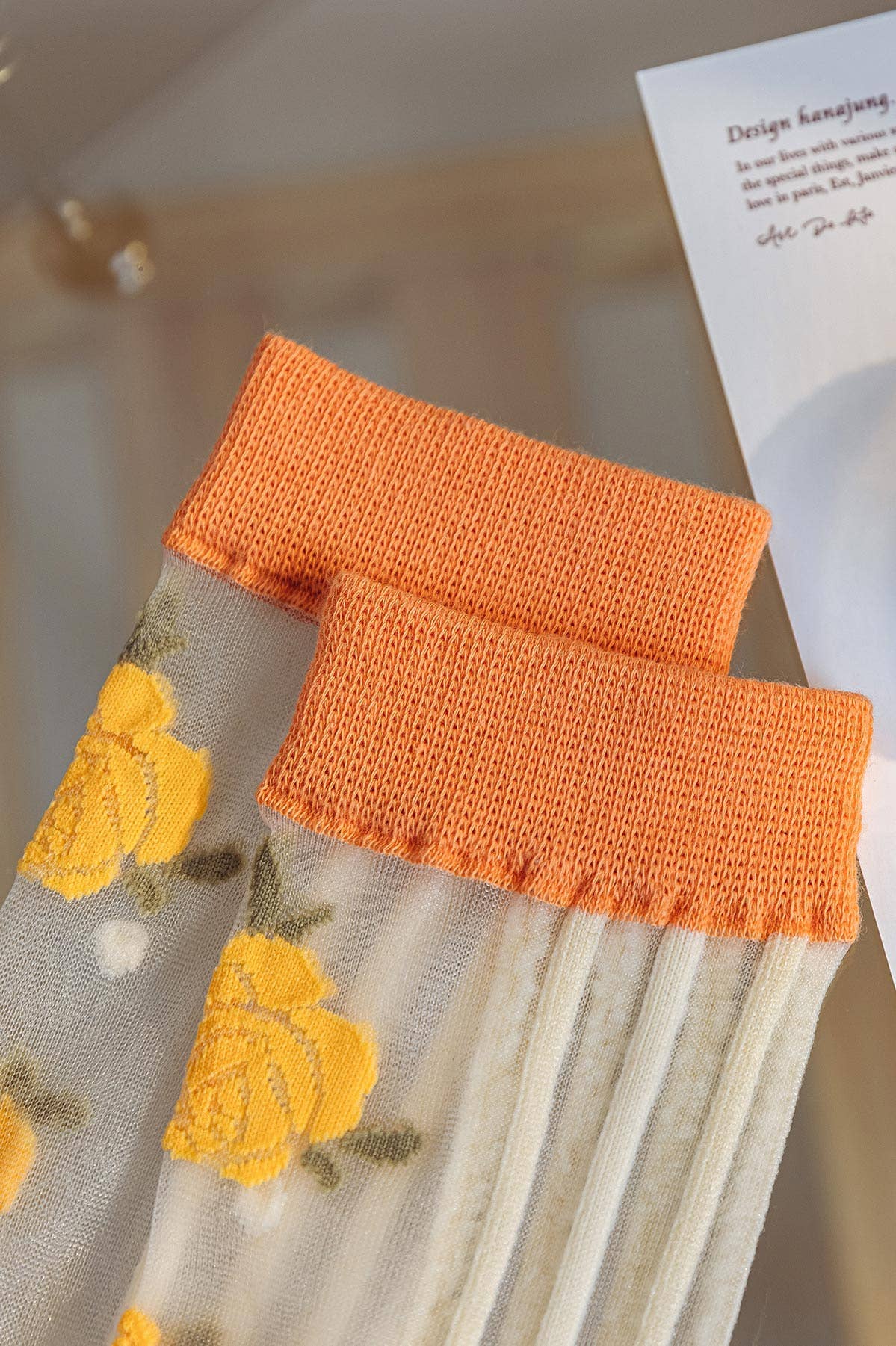Orange 🧡🌼 Transparent Stockings with Embroidered Flowers 🌼 for wholesale on Faire4