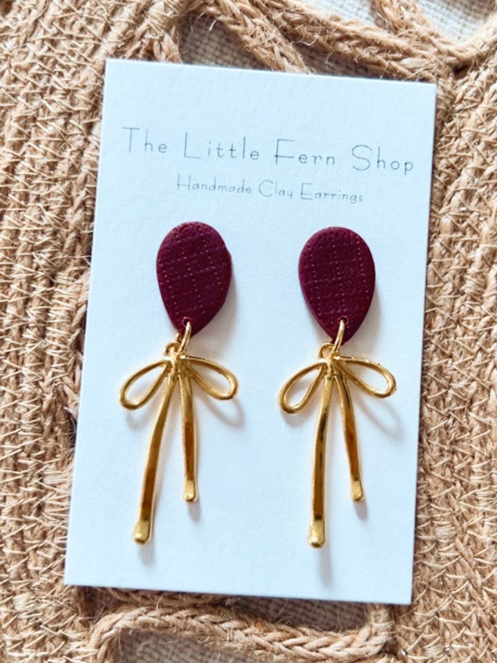 Burgundy rosettdinglar för wholesale av The Little Fern Shop