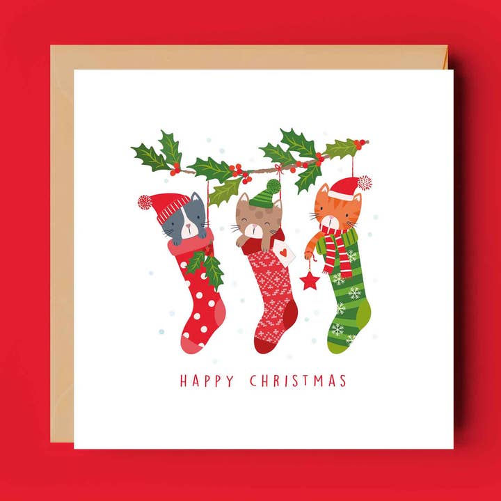 Trio af katte i strømper festligt julekort for engroshandel hos Klara Hawkins