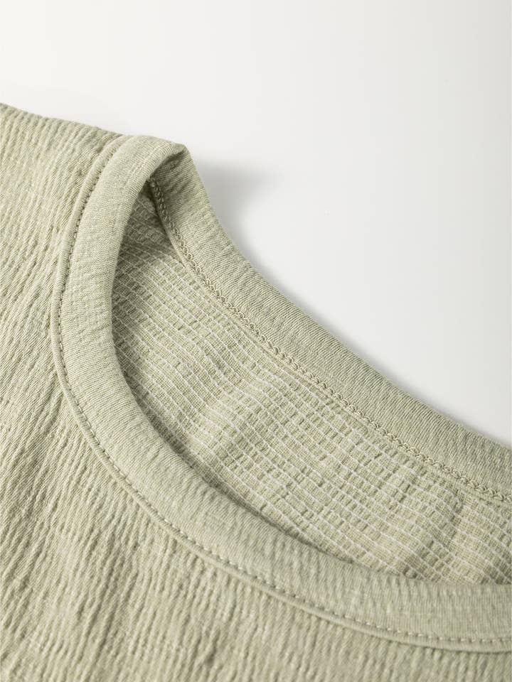 Laurel Green Textured Round Neck Half Sleeve Blouse for wholesale on Faire