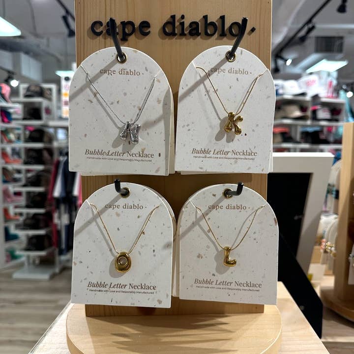 Cape Diablo - Wholesale Pendant/Charm Necklace - 57 Gold Bubble Letter Necklaces Pack1