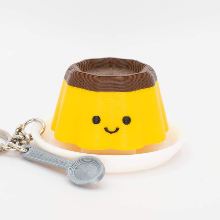 Llavero de Pudín Saltarín y Clicante (Retirado) para venta al por mayor de The Tiny Joy Factory