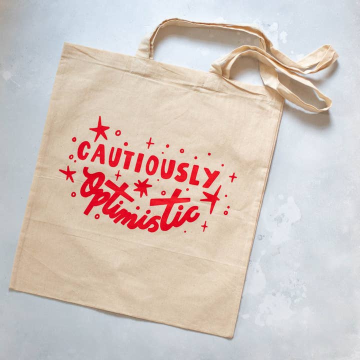 Cautiously Optimistic Tote Bag for wholesale by Finest Imaginary