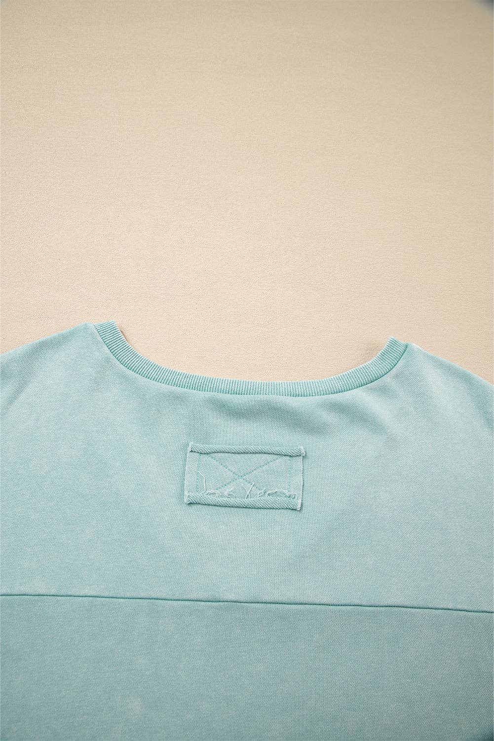 Mist Blue Mineral Wash Exposed Seam Buttoned V Neck Pullover Top for wholesale on Faire5