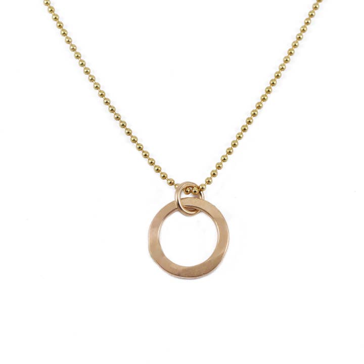 Joy Tiny Gold Hammered Circle Necklace for wholesale by Cloverleaf Jewelry
