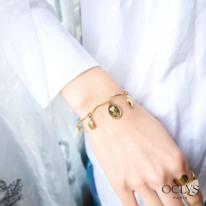 Bracciale con ciondoli in acciaio inossidabile dorato Duona per la vendita all'ingrosso da parte di Oclys