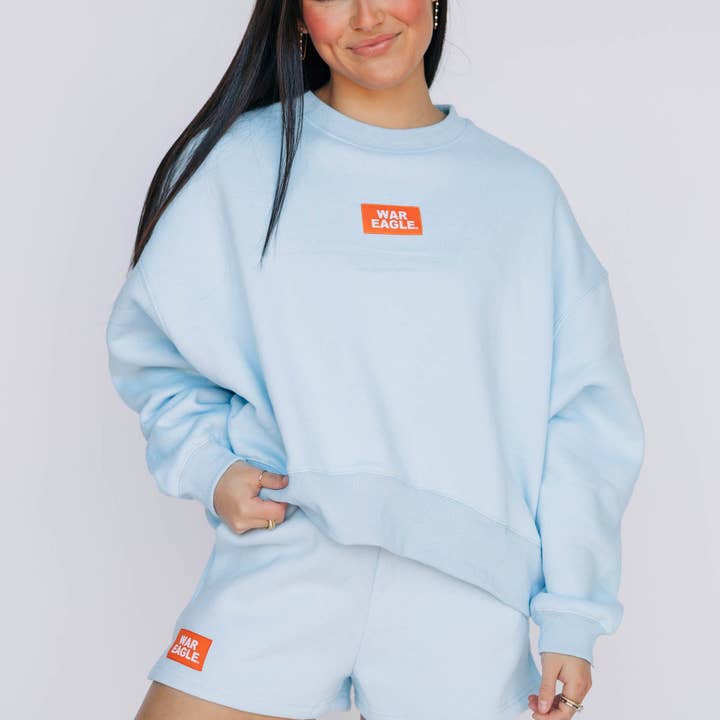 The Becca Boxy Crewneck War Eagle Woven Label | Light Blue for wholesale by Scarlet & Gold